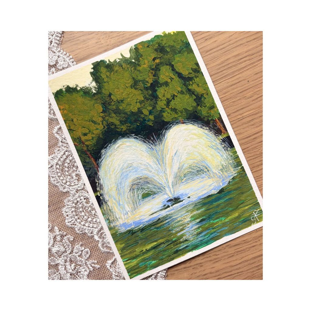 Fountain — angled view of mini painting on lace background