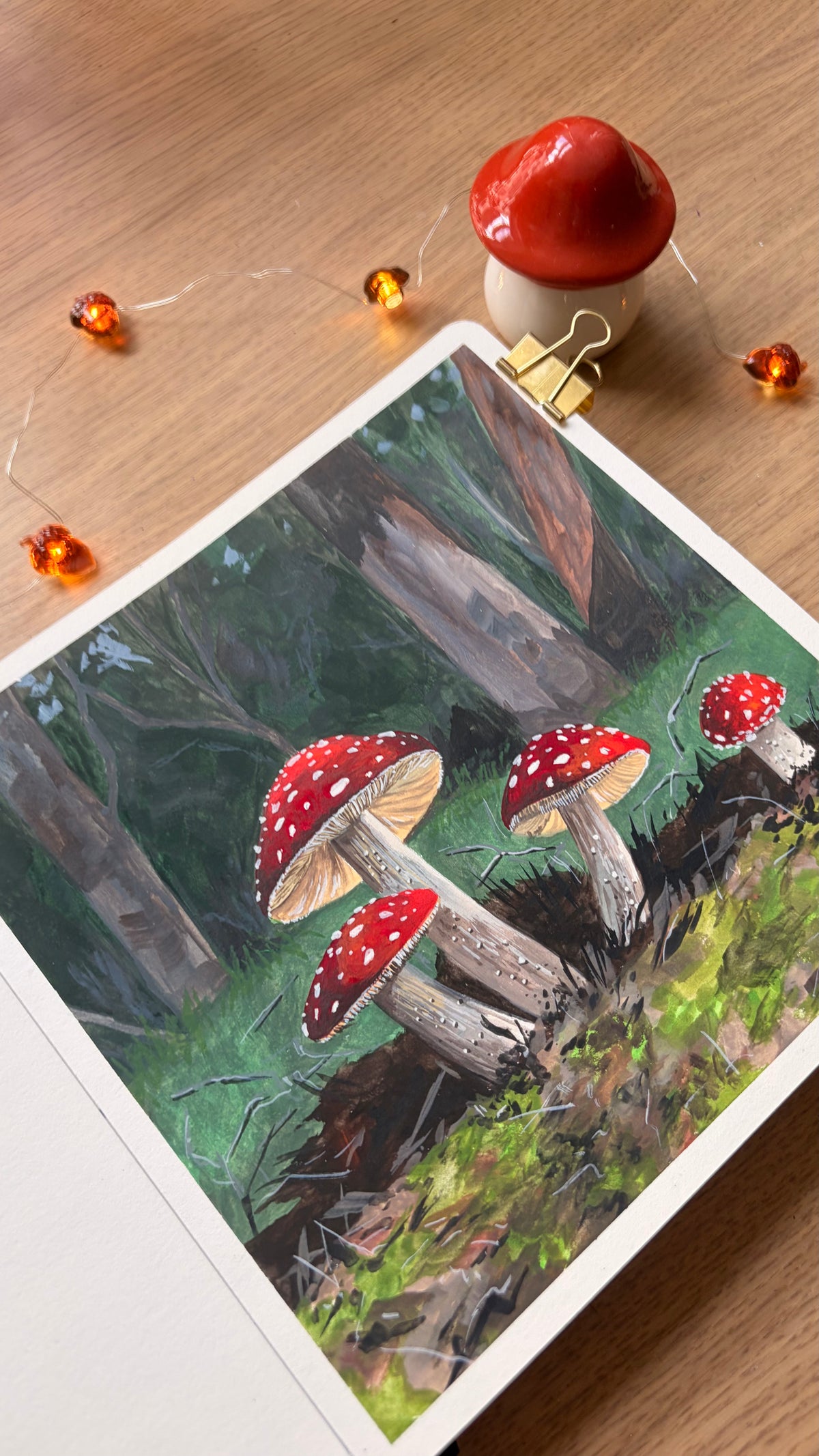Fungi — angled view of painting with mushroom figurine